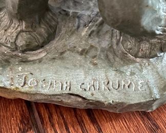 Josiah Chirume Carved Shona Stone Elephant Sculpture. Signed. Measures 26" W x 13" H. Photo 3 of 3.