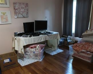 Bedroom with  linens,  televisions,  art,  picture  frames