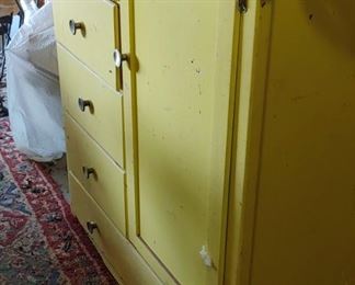 Old painted yellow cabinet
 Very unusual label inside the door reads Edison Little Folks furniture