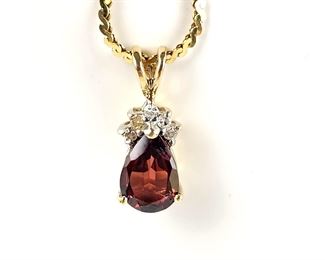14k Gold Chain and Garnet Pendant Encased in 14k Gold and Small White Diamonds. 14" Chain
