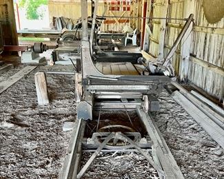 Vintage Belsaw Sawmill including track and bed, propane engine, planer, saw & belts. Must disassemble and haul 