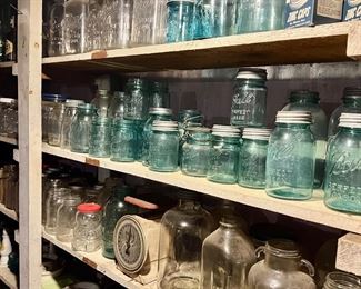 VINTAGE CANNING JARS THOUGHOUT HOME AND OUTBUILDING CLEAR AND BLUE 