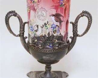 1013	VICTORIAN CRANBERRY & ENAMEL DECORATED SPOONER IN METAL HOLDER, APPROXIMATELY 8 IN HIGH
