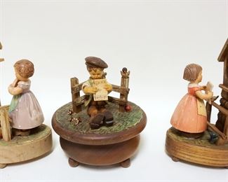 1020	LOT OF 3 SWISS WOOD FIGURAL MUSIC BOXES, TALLEST APPROXIMATELY 9 1/2 IN

