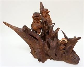 1133	FOLK ART WOOD CARVED HOBBIT LIKE FIGURES IN TREE, APPROXIMATELY 15 IN HIGH
