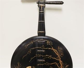 1231	BLACK LACQUERED ASIAN WALL HANGING IN THE FORM OF A BANJO, APPROXIMATELY 12 IN X 24 IN
