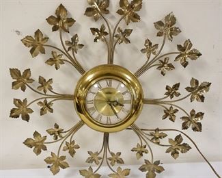 1249	MIDCENTURY MODERN BRASS WALL CLOCK, APPROXIMATELY 23 IN
