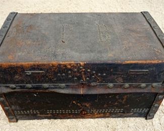 1250	ANTIQUE LEATHER TRUNK W/BRASS TACK ACCENTS, APPROXIMATELY 25 IN X 15 IN X 15 IN HIGH
