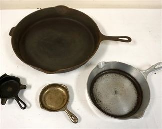 1251	LOT OF GRISWOLD CAST IRON PANS, LARGEST APPROXIMATELY 22 IN X 17 IN
