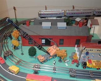 FULL TOWN WITH 3 TRAINS RUNNING THUR IT - WITH BUILDING - VEHICALS - TREES - PEOPLE - BASEBALL FIELD & PLAYERS - TRAIN STATION - TRAIN WITH FULL CARS - LOGS - ANIMALS - ETC.