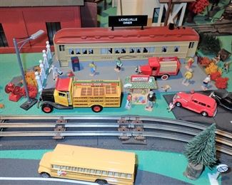 FULL TOWN WITH 3 TRAINS RUNNING THUR IT - WITH BUILDING - VEHICALS - TREES - PEOPLE - BASEBALL FIELD & PLAYERS - TRAIN STATION - TRAIN WITH FULL CARS - LOGS - ANIMALS - ETC.