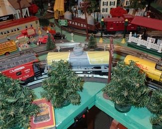 FULL TOWN WITH 3 TRAINS RUNNING THUR IT - WITH BUILDING - VEHICALS - TREES - PEOPLE - BASEBALL FIELD & PLAYERS - TRAIN STATION - TRAIN WITH FULL CARS - LOGS - ANIMALS - ETC.