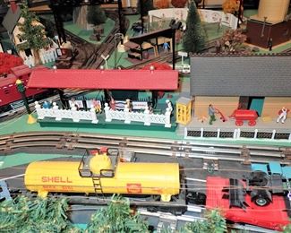 FULL TOWN WITH 3 TRAINS RUNNING THUR IT - WITH BUILDING - VEHICALS - TREES - PEOPLE - BASEBALL FIELD & PLAYERS - TRAIN STATION - TRAIN WITH FULL CARS - LOGS - ANIMALS - ETC.