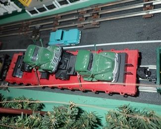 FULL TOWN WITH 3 TRAINS RUNNING THUR IT - WITH BUILDING - VEHICALS - TREES - PEOPLE - BASEBALL FIELD & PLAYERS - TRAIN STATION - TRAIN WITH FULL CARS - LOGS - ANIMALS - ETC.