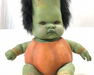 Signed Composite Seated Frankenbaby Doll
