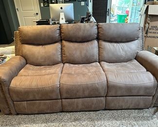 Electronic sofa with nailhead trim 