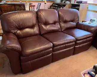 Burgundy power reclining leather sofa....