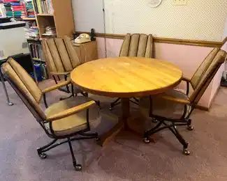Round wood table and (4) chairs (sold separately)