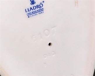 Lladro 6107 Football Player Porcelain Figurine 7.5 inches high.