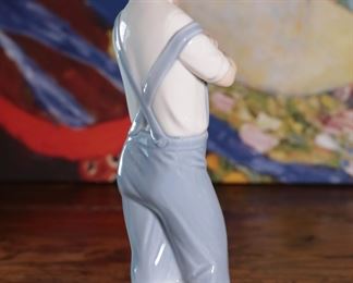 Lladro 4897 Mechanic Boy with Hammer & Toy Truck Porcelain Figurine 8.25 inches high.