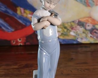 Lladro 4897 Mechanic Boy with Hammer & Toy Truck Porcelain Figurine 8.25 inches high.