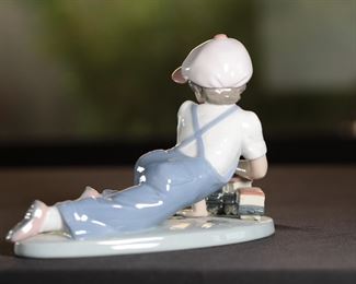 Lladro 7619 All Aboard Boy With Train Porcelain Figurine 5 inches high