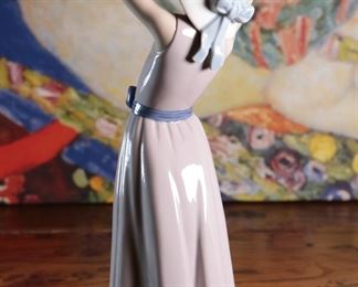 Lladro 5011 Coy Girl Holding Hat Porcelain Figurine 10.25 inches high.