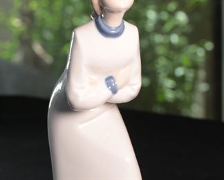 REX Spain Porcelain Figurine Girl Leaning 8.75 inches high.