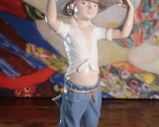 NAO By Lladro 0182 Young Cowboy Porcelain Figurine 10.5 inches high.