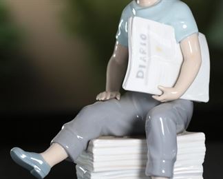 NAO by Lladro Newspaper Boy Porcelain Figurine 9.5 inches high.
