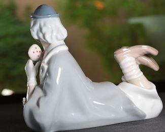Casades Porcelain Clown Lying Down Porcelain Figurine 7.25 inches high.