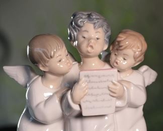 Lladro 4542 Group 3 Choir Angel Children Singing Porcelain Figurine	7.25 inches high.	
