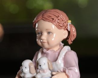 Nadal Girl with Puppies Porcelain Figurine 		
