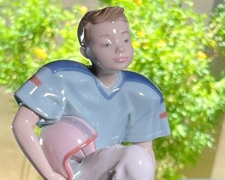 Lladro 6107 Football Player Porcelain Figurine  	7.5 inches high.	
