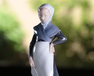 Royal Copenhagen 528 lady with Goose Porcelain Figurine	7.25 inches high.	
