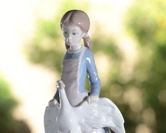 NAO by Lladro Young Girl with Goose Porcelain Figurine 	9.75 inches high.	
