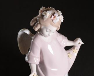 Lladro 6924 Heavenly Stars Angel Porcelain Figurine	7.5 inches high.	
