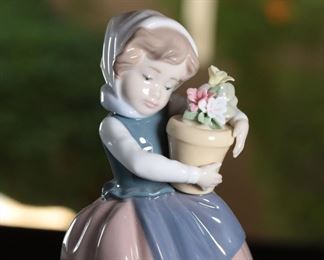 Lladro 5223 Spring is Here Girl With Flowers Porcelain Figurine	7 inches high	

