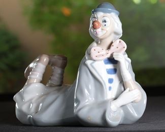 Casades Porcelain Clown Lying Down Porcelain Figurine	7.25 inches high.	
