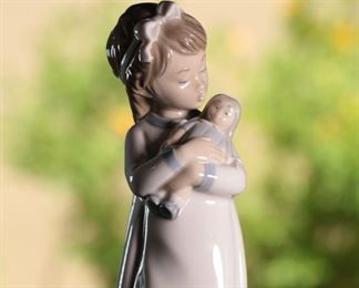 NAO by Lladro Girl Holding Doll Porcelain Figurine	10 inches high	
