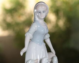 Duncan Royale Woman with Geese Porcelain Figurine	9 inches high	

