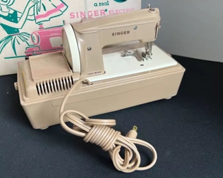 Vintage 1950's Singer Sewhandy Sewing Machine Model 50 Toy	Box: 10.5 x 13.5 x 7.in	HxWxD
