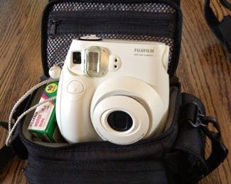 Fuji film instant camera with case, film and extras $75 