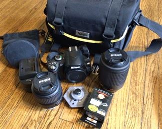 Nikon D 40x 2 lenses 55-200/18-55, battery and charger, camara bag and stand for tripod.  Several other cameras for sale