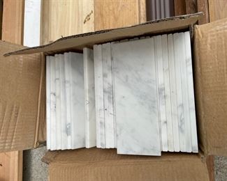 Large marble tiles. New boxes of white tiles