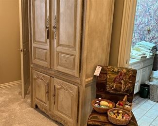 Stunning armoire with beautiful gold hardware