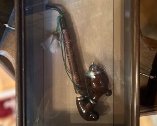 Framed antique pipe