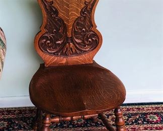 Heavily Carved Oak North Wind Chair 


 
