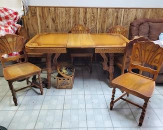30's stencil-top table with one leaf 4 chairs, however we found a few matching chairs