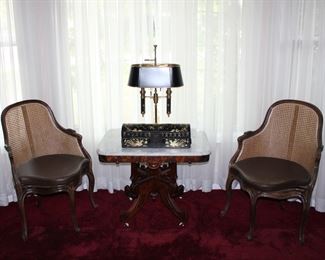 Lovely pair of carved corner chairs with caned backs and seats, one of two marble top walnut side tables, Japanese black lacquer calligraphy box with gold gilt decor, and a lovely Bouillotte lamp